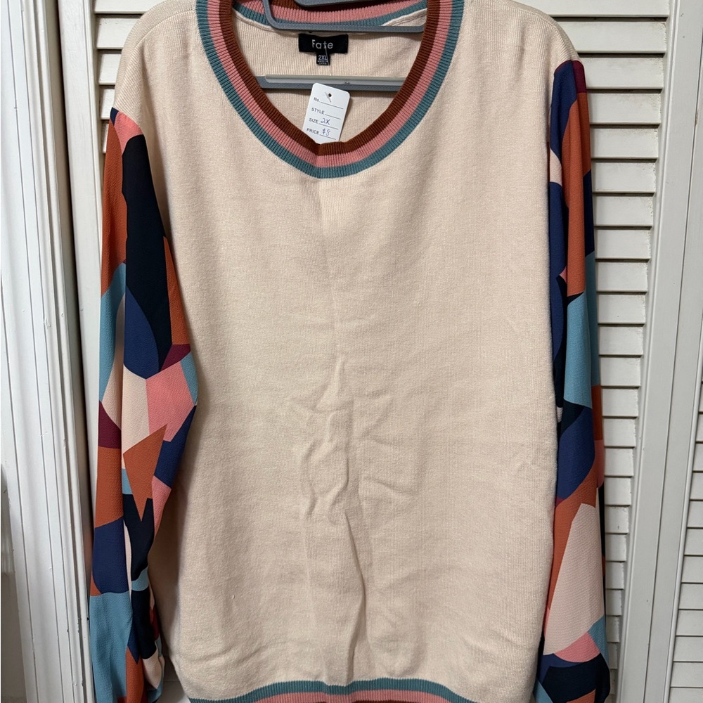 Fate Cream sweater top with Multicolor Geometric Sleeves